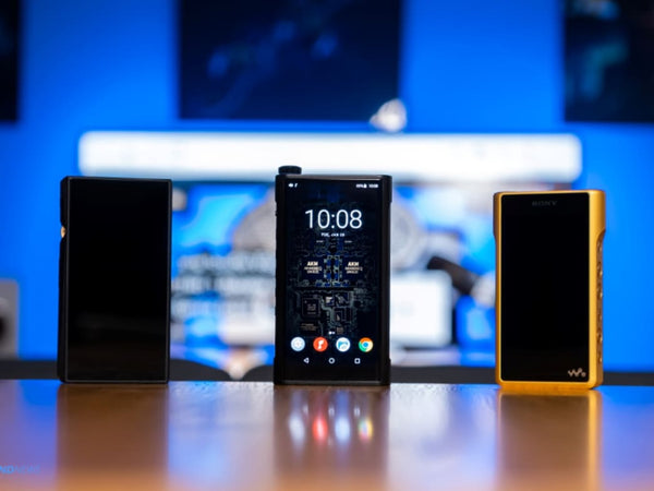 The FiiO M15 DAP stands with other DAPs on a desk